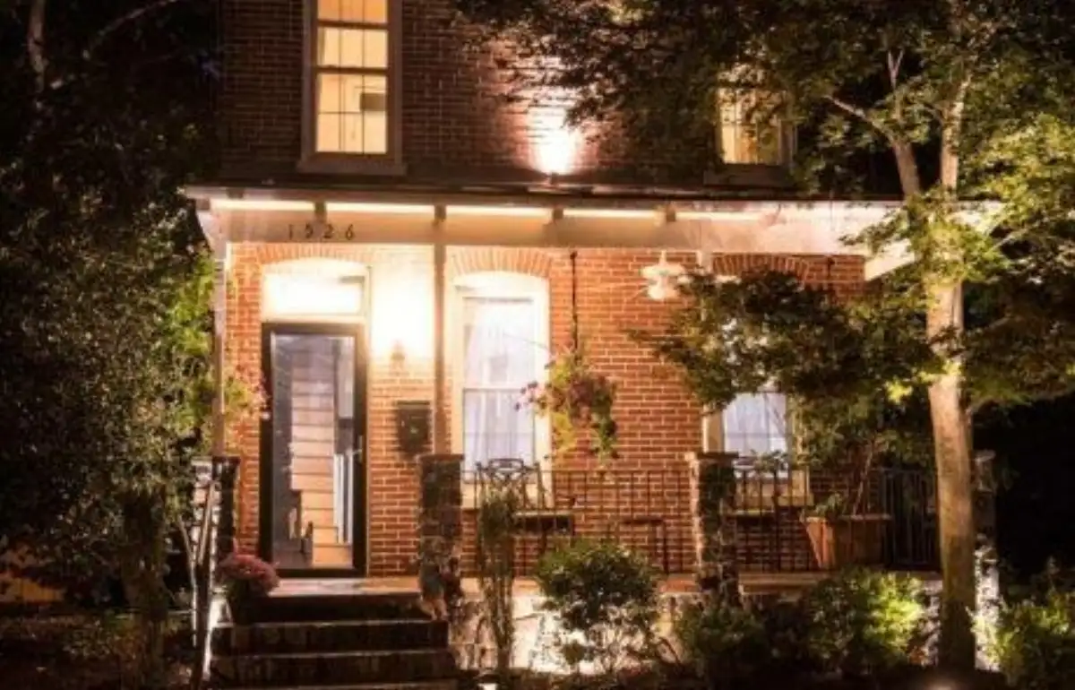 Custom outdoor fireplace with stone veneer by Evergreen Hardscaping