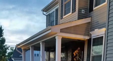 Natural stone retaining wall and paver patio by Evergreen Hardscaping in Delaware