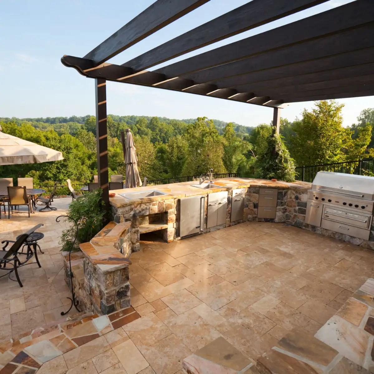 Custom stone masonry columns and wall by Evergreen Hardscaping in Delaware